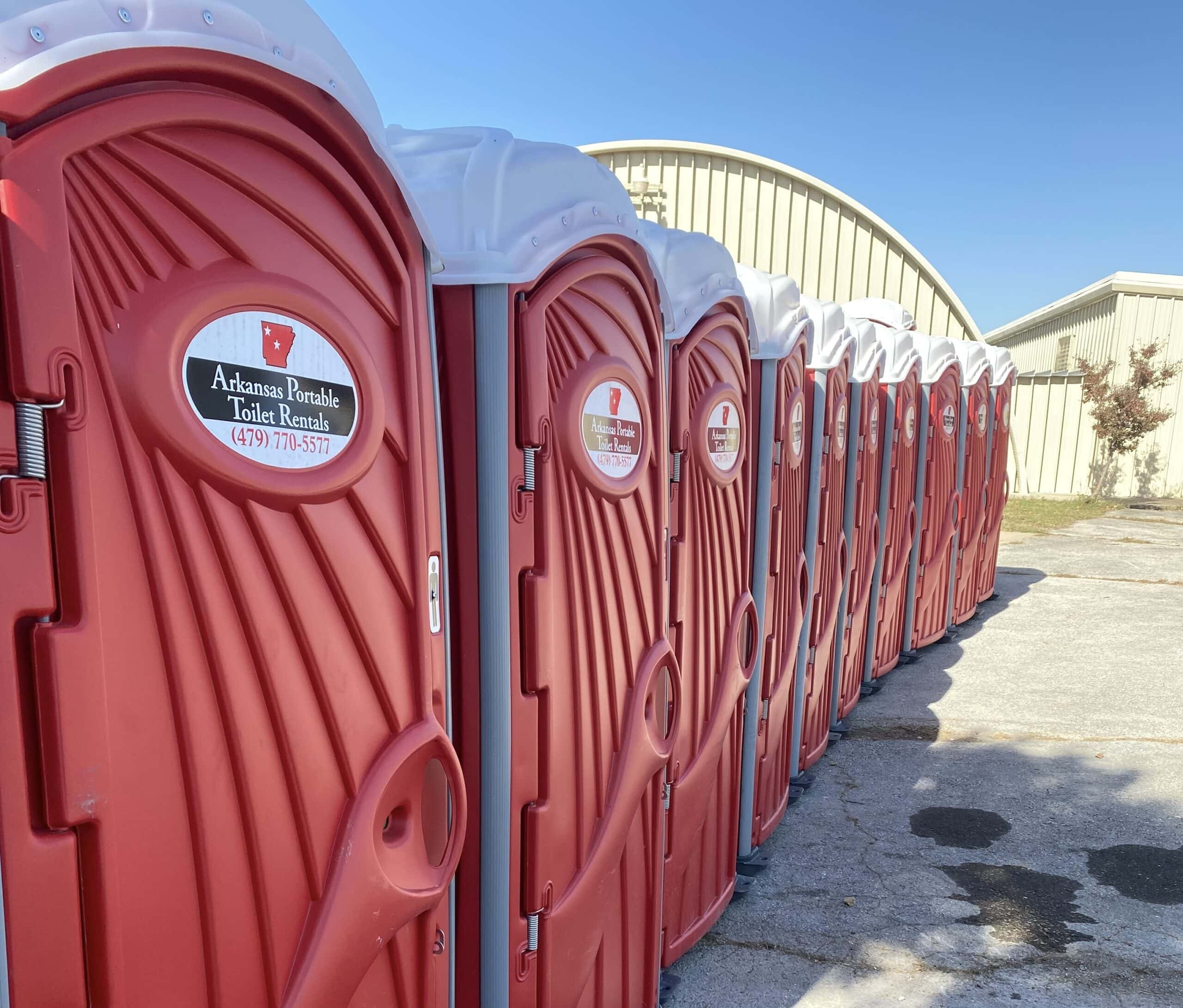 Row of orange porta potties